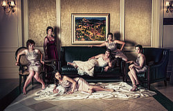 Radiant Sophistication — Inspired by the iconic editorial style of Annie Leibovitz, this portrait at Copper Creek Golf Club was a deliberate departure from traditional wedding documentation. Earlier, while reviewing the raw images from the marathon session of family formal portraits, I realized I was working with an exceptionally photogenic group of women, so I pulled the ladies aside and challenged them to pivot from 'documents' to 'art' and collaborate on a cinematic film study. Their enthusiastic response and willingness to take direction with the poise of professional models allowed us to craft this composition, and considering Leibovitz spends several days planning and executing her spectacular group portraits, I'd say we did quite well with only 1 hour — a testament to what can happen when a photographer’s vision aligns with a client's desire to create something truly special.  Of the ~453,000 wedding photos I've shot, this remains my definitive favorite.  Thank you, Annie.