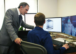 Engineering Collaboration: Fairmont Royal York. A still from a promotional video I scripted and co-directed, depicting the close relationship between the project management office and the engineering department.  Here Stephen and me are discussing the complex Royal York project.